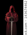 Ghostly figure in red hood with medieval sword isolated on black 143674462
