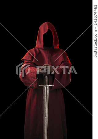 Ghostly figure in red hood with medieval sword isolated on black 143674462