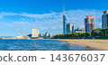 Fukuoka Tower and the cityscape of Momochihama as seen from Seaside Momochi Beach Park in Fukuoka. 143676037