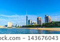 A panoramic view of Fukuoka Tower, Momochi Beach, and Hakata Bay against a blue sky. 143676043