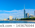 Fukuoka Tower and the townscape of Seaside Momochi as seen across Hakata Bay. 143676044