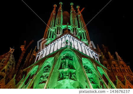 Sagrada Familia Passion facade glowing at night Sagrada Familia Passion facade glowing at night 143676237