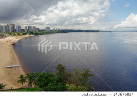 Beautiful view of Ponta Negra beach in Manaus, AM, Brazil, bathed by Negro river. Aerial 143676924