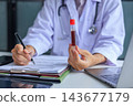 Medical worker checking biochemistry blood screening report on desk. 143677179