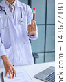 Healthcare professional holding blood sample tube. Hematology checkup and health assessment by medical specialist concept. 143677181