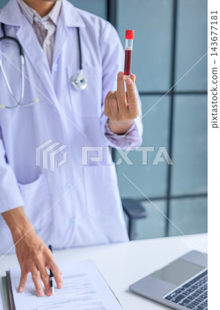 Healthcare professional holding blood sample tube. Hematology checkup and health assessment by medical specialist concept. 143677181
