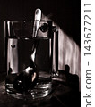 Black and White Photo of Water Glass and Spoon with Beautiful Light 143677211