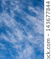 Swirling Cirrus Clouds Texture in Bright Blue Sky 143677844