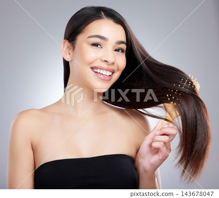 Portrait, woman and haircare with brushing, keratin and silk press for beauty, confidence or pride. Female person, wellness and cosmetic for volume, treatment or healthy growth in studio background Portrait, woman and haircare with brushing, keratin and silk press for beauty, confidence or pride. Female person, wellness and cosmetic for volume, treatment or healthy growth in studio background 143678047