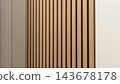 Vertical wood slat wall with warm natural grain and narrow dark gaps in a minimalist interior architectural detail 143678178