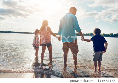 Family, water and vacation in beach, holding hands and travel for summer, holiday and nature of California. Parents, kids and adventure in tropical, sea and man with woman, together and children 143678372