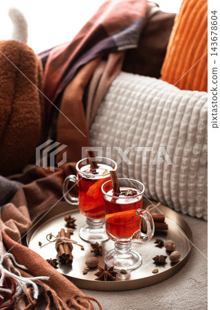 Cozy autumn setup with hot mulled wine in glasses on metal tray Cozy autumn setup with hot mulled wine in glasses on metal tray 143678604