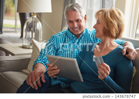 Senior couple, tablet and credit card in house for e commerce, decision or sale on web on sofa in living room. Old man, woman and fintech app for banking with deal, discount or smile on couch in home 143678747