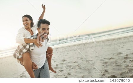 Couple, holiday and piggy back at beach with smile, love and happy for connection on adventure. Man, woman and playful on vacation, games and flight in nature by sea, waves and mockup space at sunset Couple, holiday and piggy back at beach with smile, love and happy for connection on adventure. Man, woman and playful on vacation, games and flight in nature by sea, waves and mockup space at sunset 143679040