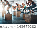 Training, class and people with jumping in group for exercise, workout and fitness for power challenge. Sports, crowd or performance in gym club for health, strong legs or athlete on box for wellness 143679282