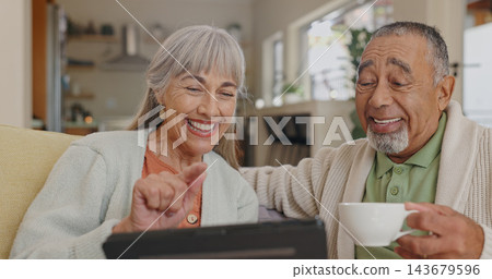 Tablet, laughing and senior couple on couch with retirement meme and streaming comedy film in home. Interracial marriage, elderly man and woman with tech on sofa for funny gif and reading silly story Tablet, laughing and senior couple on couch with retirement meme and streaming comedy film in home. Interracial marriage, elderly man and woman with tech on sofa for funny gif and reading silly story 143679596