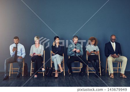Business people, recruitment and waiting in row with technology for hiring process and employment opportunity. Diverse group, job seeker and phone in line for HR meeting with mockup space and banner Business people, recruitment and waiting in row with technology for hiring process and employment opportunity. Diverse group, job seeker and phone in line for HR meeting with mockup space and banner 143679949