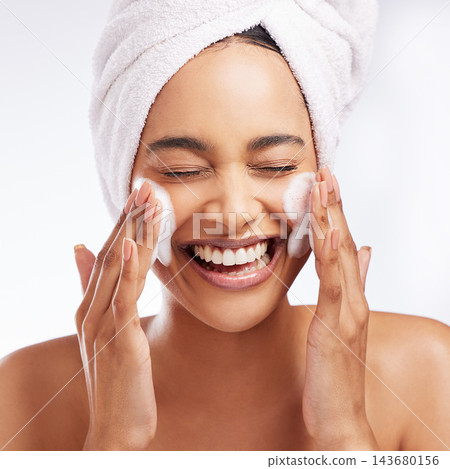 Foam wash, hands and woman in studio with skincare for cosmetics, natural glow or shine treatment on white background. Towel, body and model cleaning face for wellness, dermatology or morning routine Foam wash, hands and woman in studio with skincare for cosmetics, natural glow or shine treatment on white background. Towel, body and model cleaning face for wellness, dermatology or morning routine 143680156