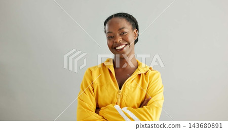 Portrait, smile or black woman with arms crossed, trendy or confident model on grey studio background. African person, face or happy girl with casual clothing, fashion or cheerful with stylish outfit Portrait, smile or black woman with arms crossed, trendy or confident model on grey studio background. African person, face or happy girl with casual clothing, fashion or cheerful with stylish outfit 143680891