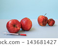 Two fresh young apples beside syringe and two old wrinkled rotten apples on light blue background, copy space. Concept of anti-aging, cosmetology injections, rejuvenation, youth and aging 143681427