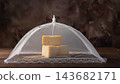 Semi-aged cheeses,beautiful and delicious semi-aged cheeses at various stages of maturation covered with fine cloth and resting on a rustic wooden table; selective focus. 143682171