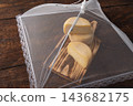 Semi-aged cheeses,beautiful and delicious semi-aged cheeses at various stages of maturation covered with fine cloth and resting on a rustic wooden table; selective focus. 143682175