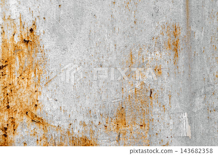 Rusty metal surface texture, peeling grey and orange paint. Flat lay macro photograph of heavily corroded metal plate, flaking light grey paint, bright orange rust stains, grungy industrial background Rusty metal surface texture, peeling grey and orange paint. Flat lay macro photograph of heavily corroded metal plate, flaking light grey paint, bright orange rust stains, grungy industrial background 143682358