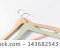 Minimal Clothes Hangers Close Up on Light Background 143682543