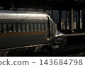 An N700 series Shinkansen departing the station before dawn. 143684798