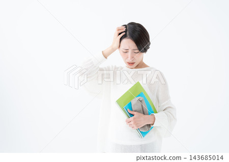 A woman studying for a qualification - risking A woman studying for a qualification - risking 143685014