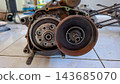 Disassembled Motorcycle Clutch and Flywheel Mechanism 143685070