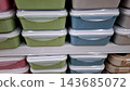 Stacked Plastic Food Storage Containers on Shelf 143685072