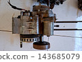 Disassembled Motorcycle Engine Crankcase and Gears 143685079