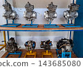 Row of Motorcycle Engines on Display Stands 143685080