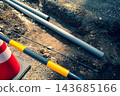 Pipes before being buried underground; warm and cool colors emphasized. 143685166