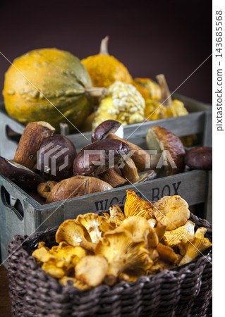 Wild Mushrooms and Autumn Gourds in Rustic Market Baskets Wild Mushrooms and Autumn Gourds in Rustic Market Baskets 143685568