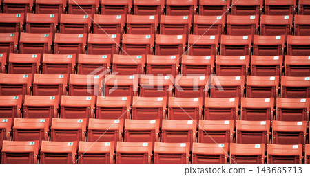 Empty Red Stadium Seats in Repeating Arena Rows Empty Red Stadium Seats in Repeating Arena Rows 143685713