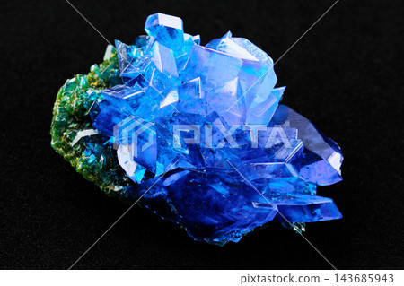 Blue Crystal Mineral Cluster Macro on Black Background Blue Crystal Mineral Cluster Macro on Black Background 143685943