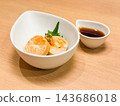 Monkfish liver with ponzu sauce. Garnished with green onions and perilla leaves. 143686018