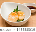 Monkfish liver with ponzu sauce. Garnished with green onions and perilla leaves. Close-up. 143686019