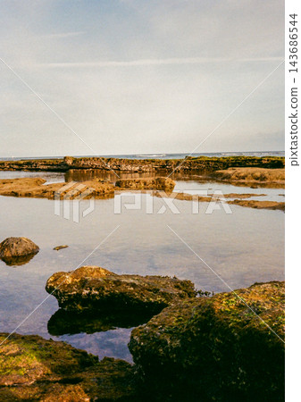 Calm Tide Pools on a Rocky Shore Calm Tide Pools on a Rocky Shore 143686544