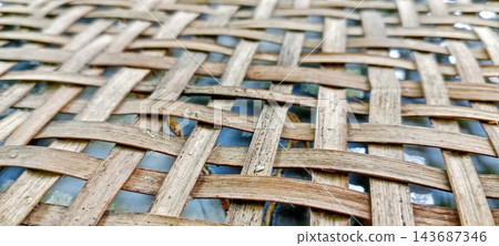 Close up of traditional bamboo woven basket texture Close up of traditional bamboo woven basket texture 143687346