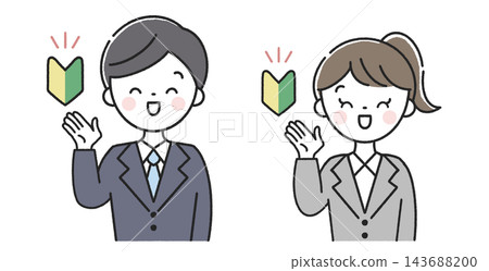 一名男員工和一名女員工手持新手駕駛標誌,面帶微笑地為駕駛指路。 一名男員工和一名女員工手持新手駕駛標誌,面帶微笑地為駕駛指路。 143688200