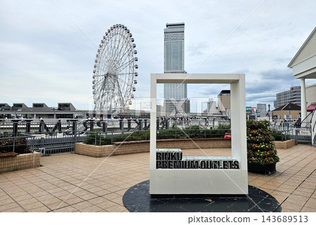 Rinku Premium Outlets Sign with Rinku Gate Tower Building and Giant Ferris Wheel in Osaka, Japan. Rinku Premium Outlets Sign with Rinku Gate Tower Building and Giant Ferris Wheel in Osaka, Japan. 143689513