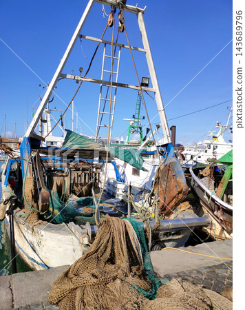 Old rusty fisher boats in a port at Civitavecchia, Lazio, Italy Old rusty fisher boats in a port at Civitavecchia, Lazio, Italy 143689796