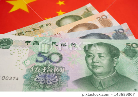 China yuan banknote money with flag, investment economy business and banking. China yuan banknote money with flag, investment economy business and banking. 143689807
