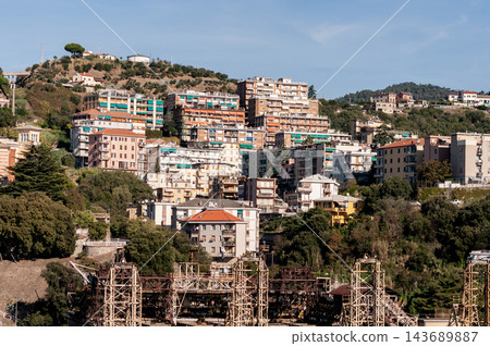 Savona, Italy with port and hillside buildings, panoramic coastal view Savona, Italy with port and hillside buildings, panoramic coastal view 143689887