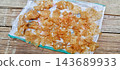 Traditional dried rice crackers on sack 143689933