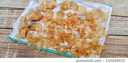 Traditional dried rice crackers on sack Traditional dried rice crackers on sack 143689933