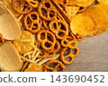 Mix of variety snack chips pretzel and cracker, junk crunchy food. 143690452